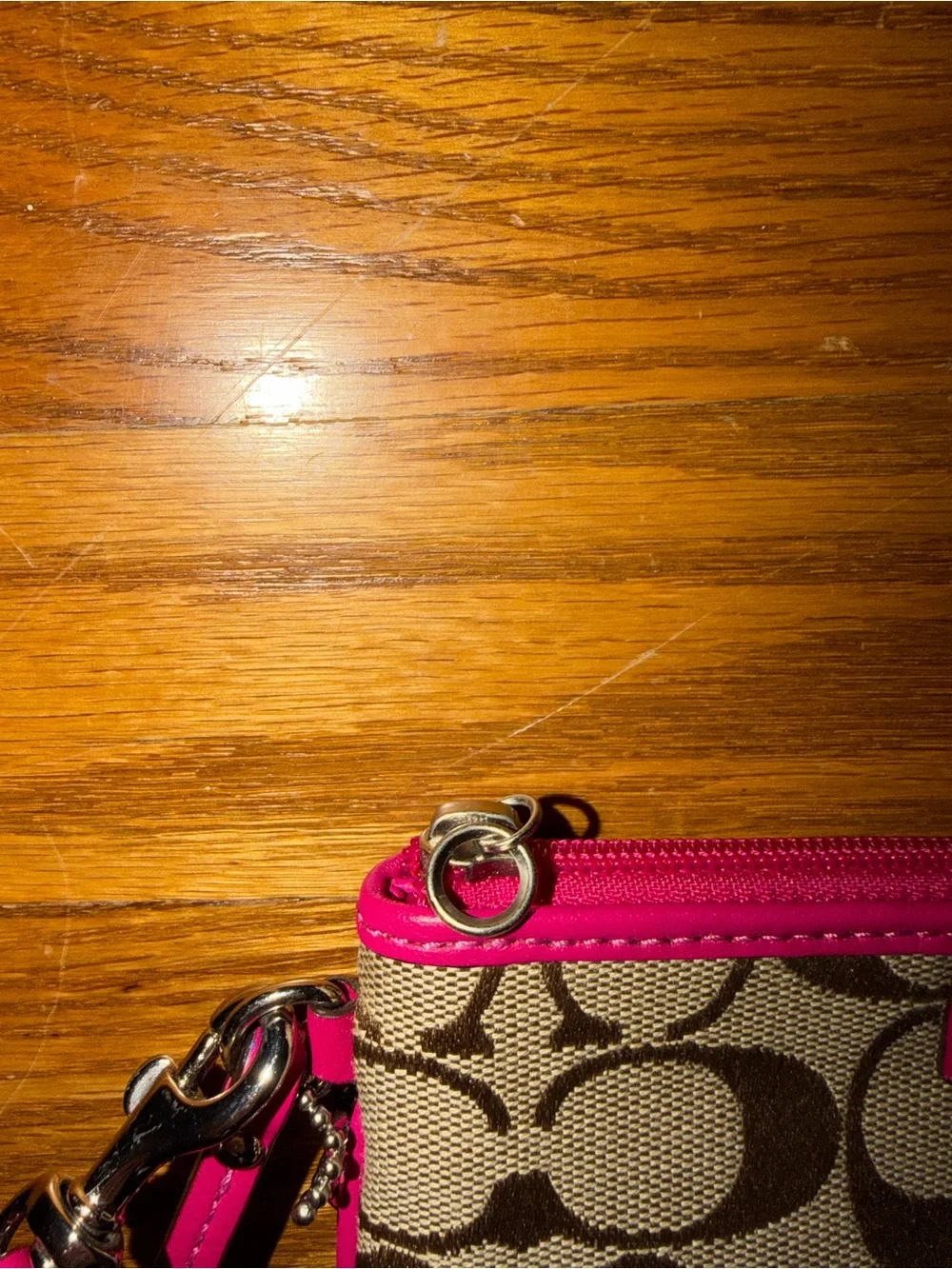 Coach wristlet featuring